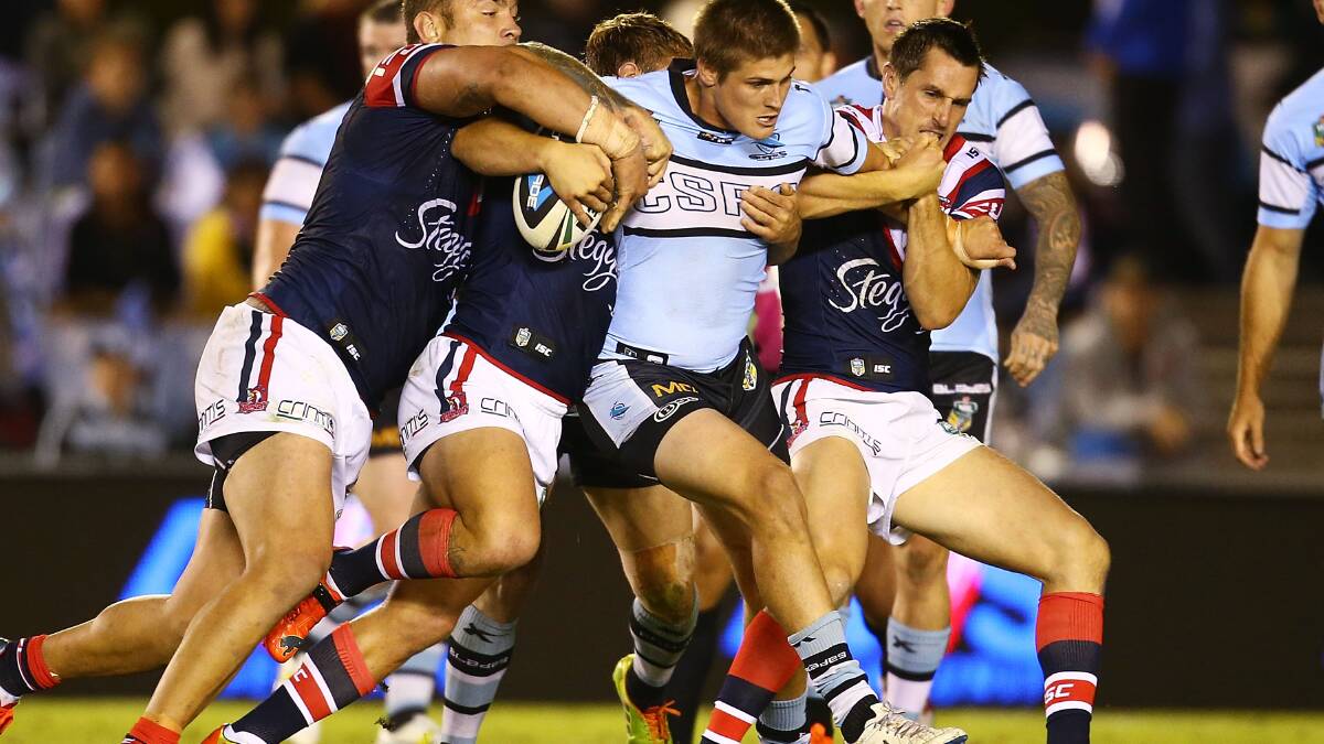 Blake Ayshford of the Sharks is tackled during the round seven NRL match between the Cronulla-Sutherland Sharks and the Sydney Roosters at Remondis Stadium on April 19, 2014 in Sydney, Australia. Photo: Mark Nolan/Getty Images.
