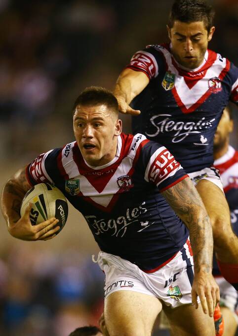  Shaun Kenny-Dowall of the Roosters makes a line break during the round seven NRL match between the Cronulla-Sutherland Sharks and the Sydney Roosters at Remondis Stadium on April 19, 2014 in Sydney, Australia. Photo: Mark Nolan/Getty Images.