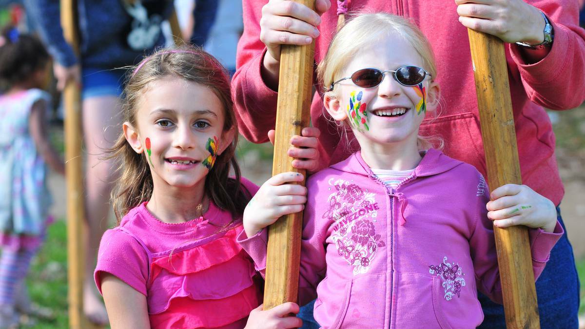 ORANGE: Sonja and Julia Loecker are pretty in pink at Robertson Park on Sunday as families gathered for the Easter Family Festival. Photo: Jude Keogh/Central Western Daily.