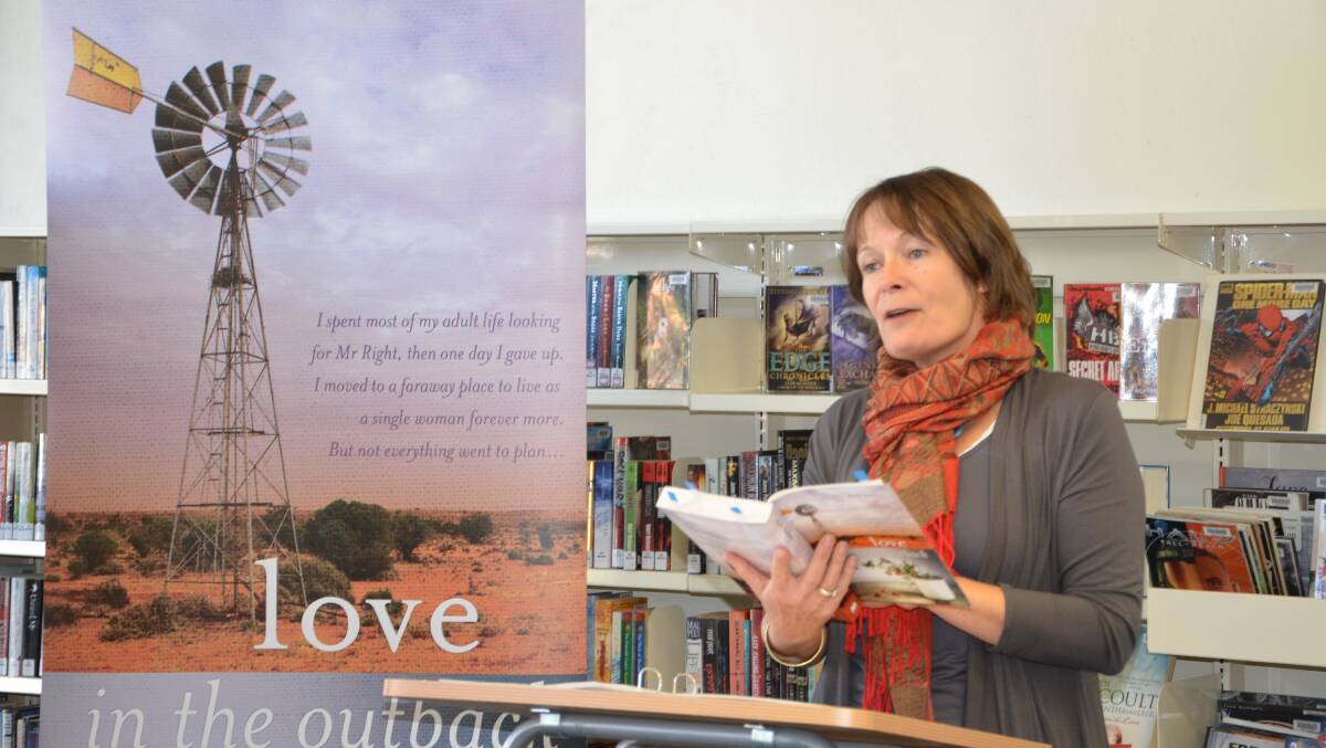 Deb Hunt reading from her book Love in the Outback at the Macquarie Regional Library yesterday. 		         Photo: STEPHANIE KONATAR.
