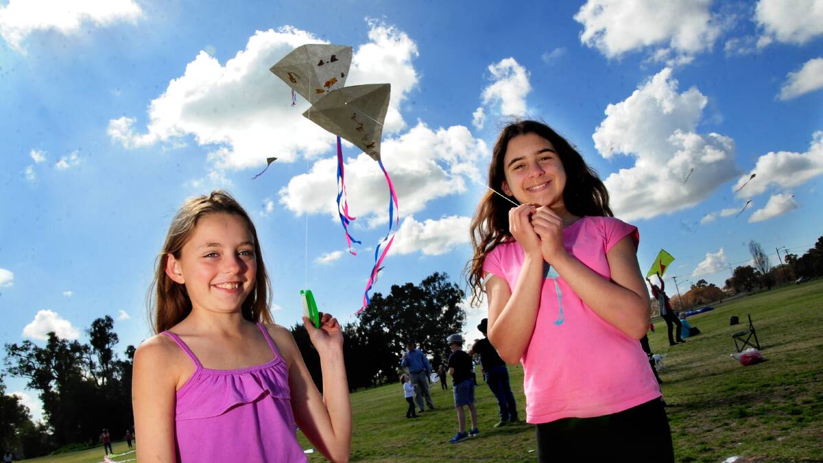 Abbie Herbert and Savannah Ovrahim with the kites they made. Photo: LOUISE DONGES.