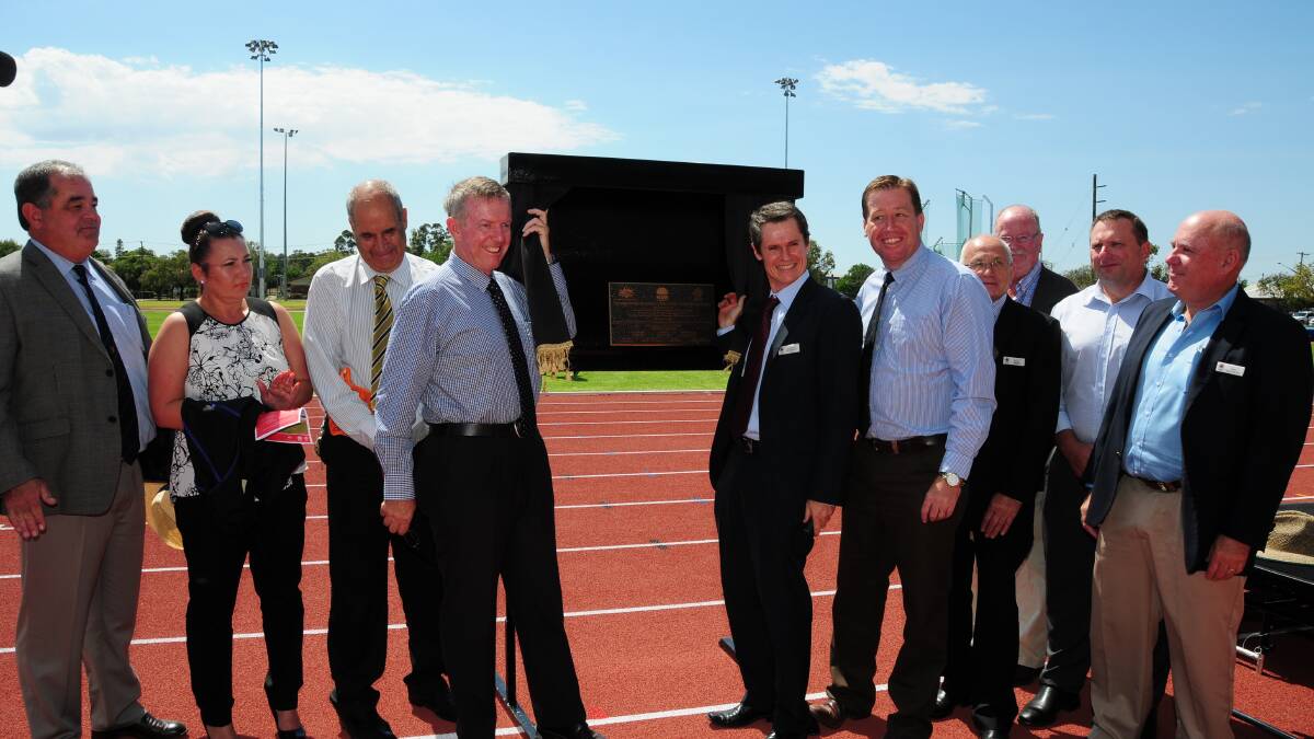 John Walkom, Tina Reynolds, Rod Towney, Mark Coulton, Mathew Dickerson, Troy Grant, Kevin Parker, Allan Smith, Greg Mohr and Greg Matthews unveil the plaque for the Barden Park Centre for Excellence for Athletics. Photo: GREG KEEN.
