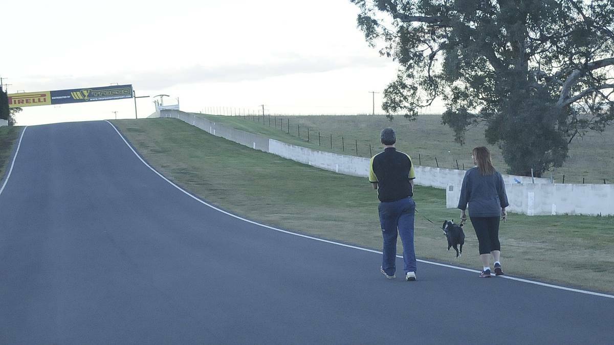 KEEP RIGHT: Mount Panorama walkers have been warned they should not walk more than two abreast and should always walk so they are facing the approaching traffic. Photo: CHRIS SEABROOK 