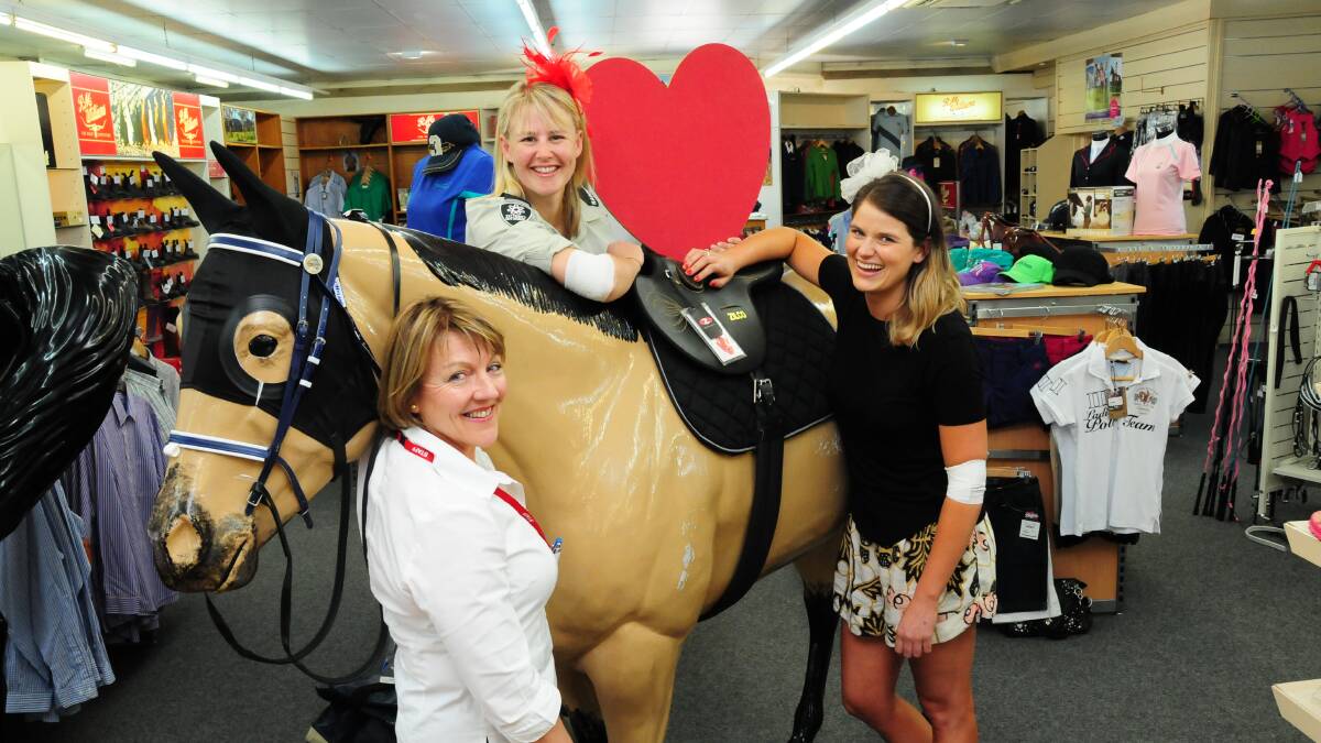 (Back) Kristie Klaassens Dubbo City Council ranger (front) Erin Mannix Red Cross administration officer and Debbie Garden Red Cross donor centre manager preparing for the Melbourne Cup blood donation challenge. Photo: GREG KEEN.