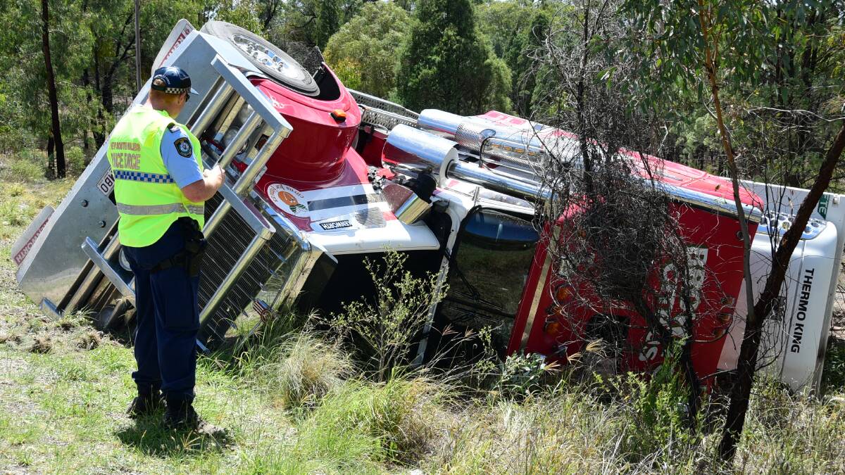 Emergency services were called to reports of a truck rollover outside Dubbo on Wednesday morning. Photos: BELINDA SOOLE