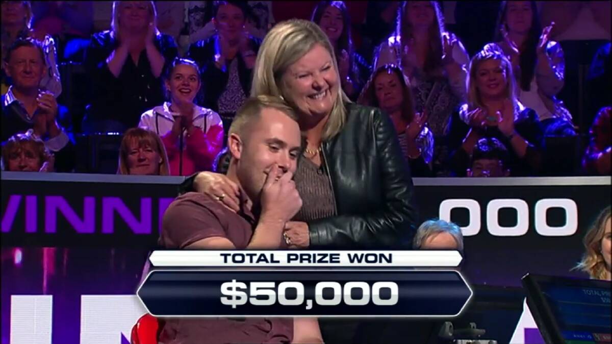 Dr Jarrod Rawson is congratulated by proud mother Kathy shortly after winning $50,000 in Channel Nine's Millionaire Hot Seat. Photo: CHANNEL NINE