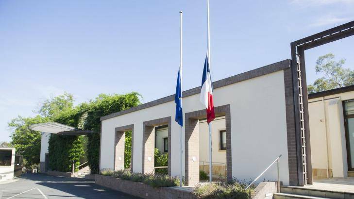 Flags at the French embassy in Canberra flew at half-mast yesterday after the terrorist attack in Paris.