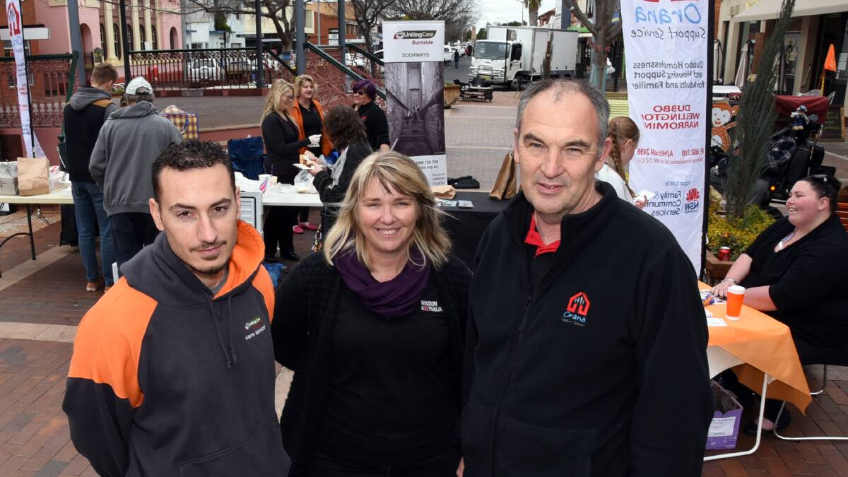 Adam Wiseman of UnitingCare Burnside, Mel Charlton of Mission Australia and Peter Gallagher of Orana Support Service help raise awareness of homelessness at a Homelessness Prevention Week event at the Church street rotunda. Photo: BELINDA SOOLE