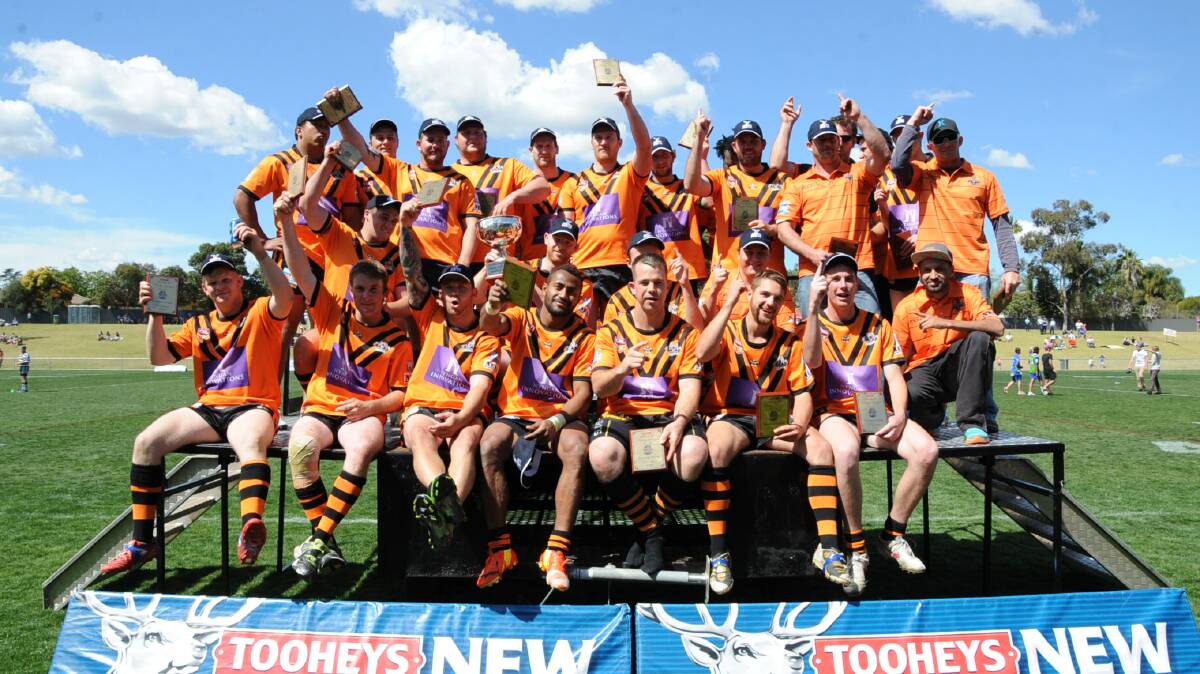 The victorious Nyngan Tigers celebrate their historic Group 11 reserve grade grand final win. 								 Photos: Belinda Soole