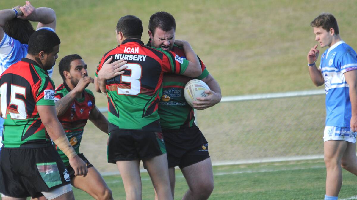 Dylan Hill celebrates with Westside teammates after scoring against Macquarie on Saturday. 
Photo: KATHRYN O'SULLIVAN