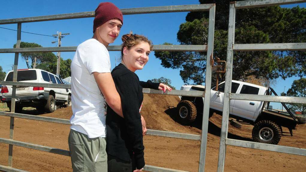 Jaycen Herbert and Naomi Carter get up close to the four-wheel drive action at the Orana Caravan, Camping, 4WD, Fish & Boat Show at the weekend. Photo: CHERYL BURKE