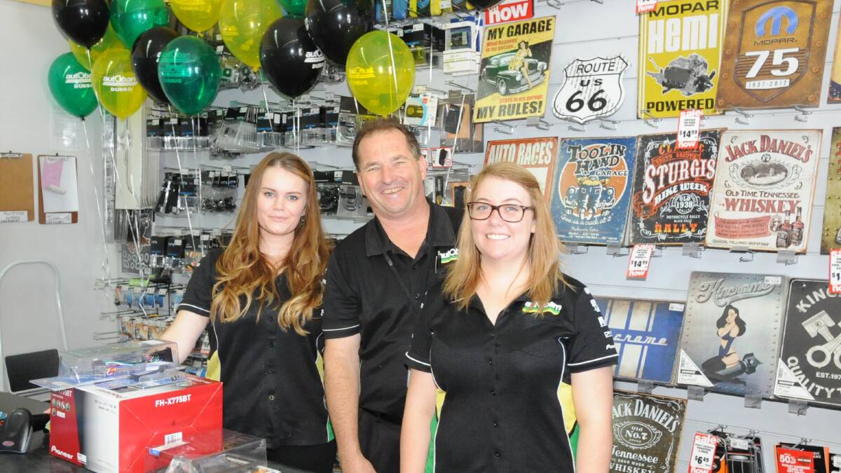 Ayesha Schloeffel, Neil Sturrock and Kelsey Simpson were working hard at the Autobarn Dubbo Boxing Day sale. Photo: HANNAH SOOLE