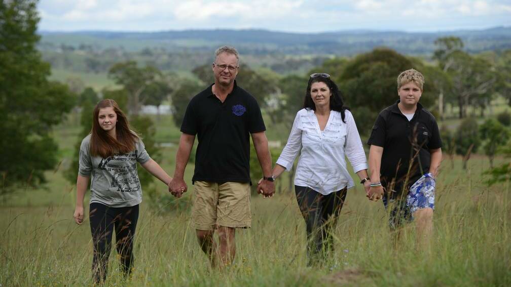 From left, Gabby Williams, 13 with father Jeff, morther Narelle and brother Kyle, 14. Mrs Williams uses cannabis oil for pain relief. Photo: BARRY SMITH