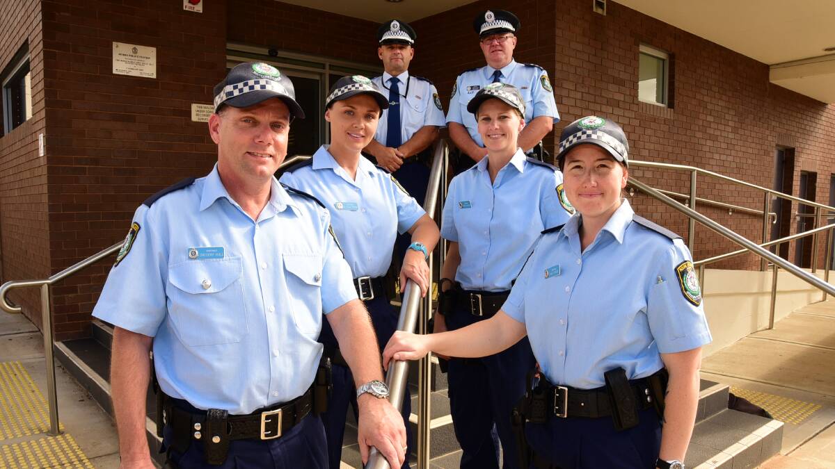 New probationary constables Greg Hull, Kaiti Moon (front), Melinda Brown and Vanessa Menzies (centre) with Orana LAC duty officers Dan Skelly and Malcolm Andrews (back). Photo: BELINDA SOOLE