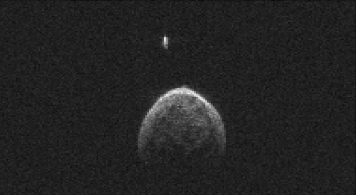  Asteroid 2004 BL86 with its moon that was trailing behind it as it passed Earth on Monday. Photo: NASA
