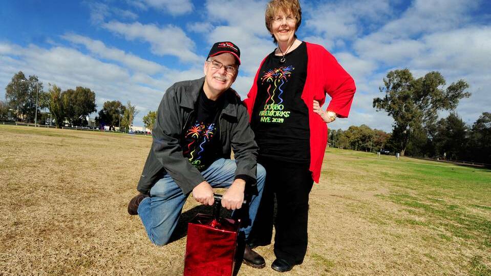 Dubbo Fireworks Inc chairman Peter Judd and sponsorship manager Jan Grady prepare to light up Dubbo on New Year's Eve. Photo: LOUISE DONGES