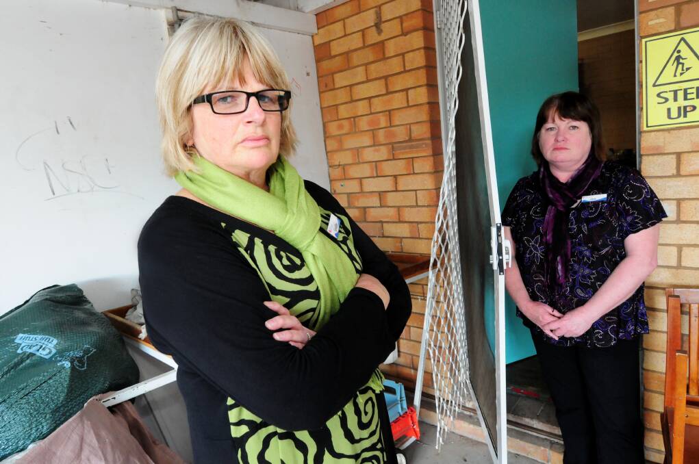 Emmanuel Care Centre manager Geraldine Tosh and assistant manager Ann Sim standing near where the building was entered by breaking the screen door. Photo: LOUISE DONGES