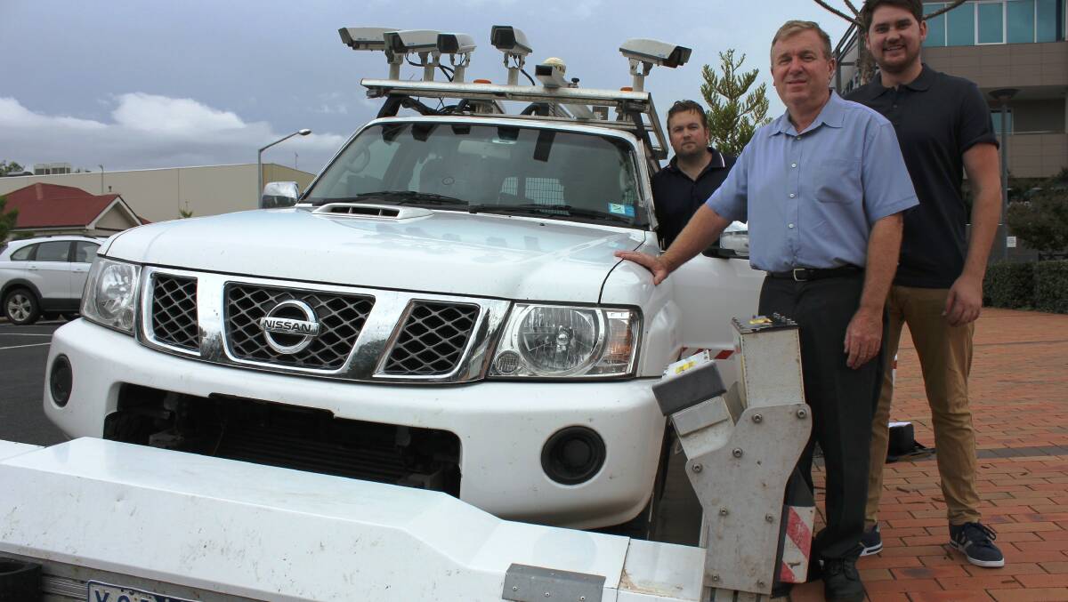 Dubbo City Council asset systems engineer Michael McCulloch (centre) and Joel Bradley and Ryan Warren from Australian Road Research Board with the road condition survey vehicle. Photo contributed.