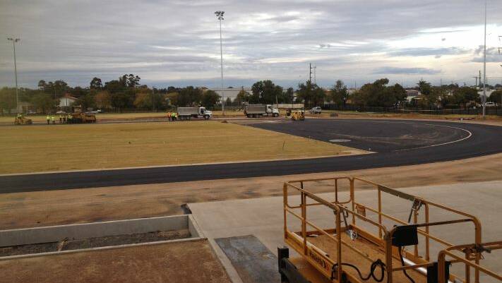 Workers begin to lay the foundation for an international-standard synthetic athletics track at Dubbo's Barden Park. Photo contributed