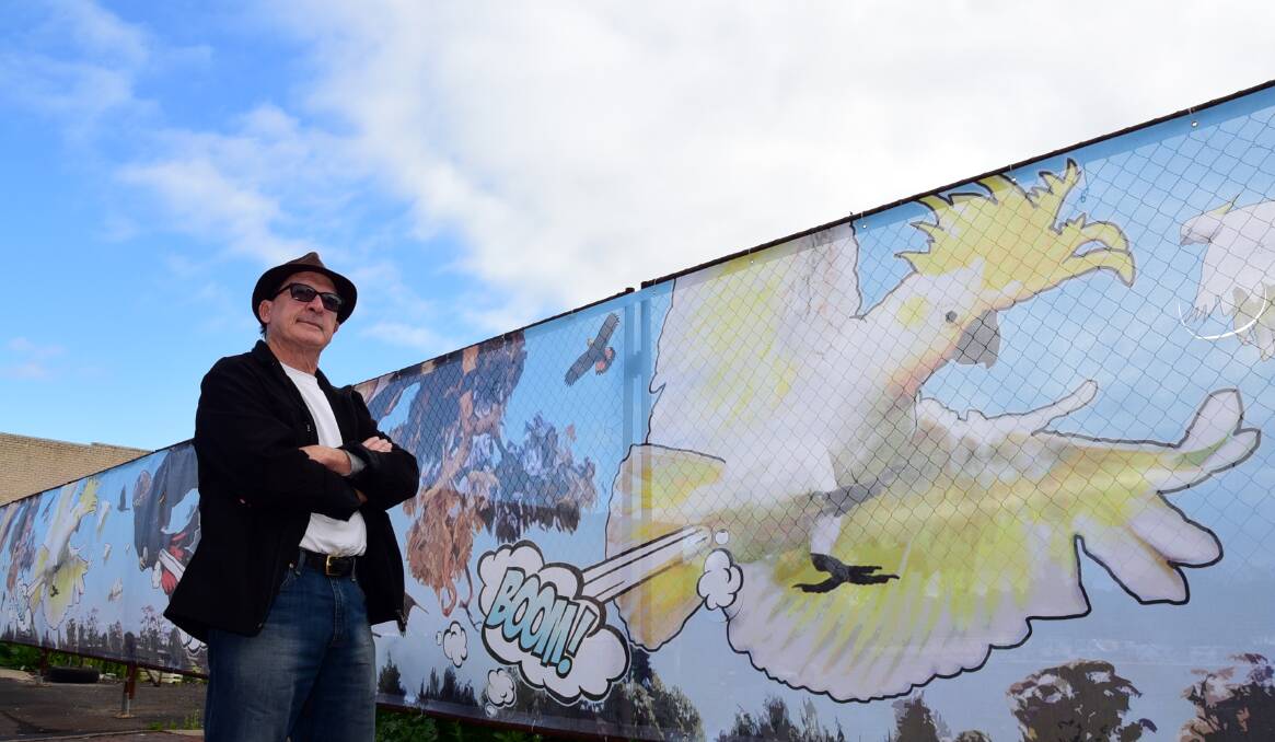 Artist Jack Randell with the public artwork he created for a prime Dubbo streetscape. Photo: BELINDA SOOLE