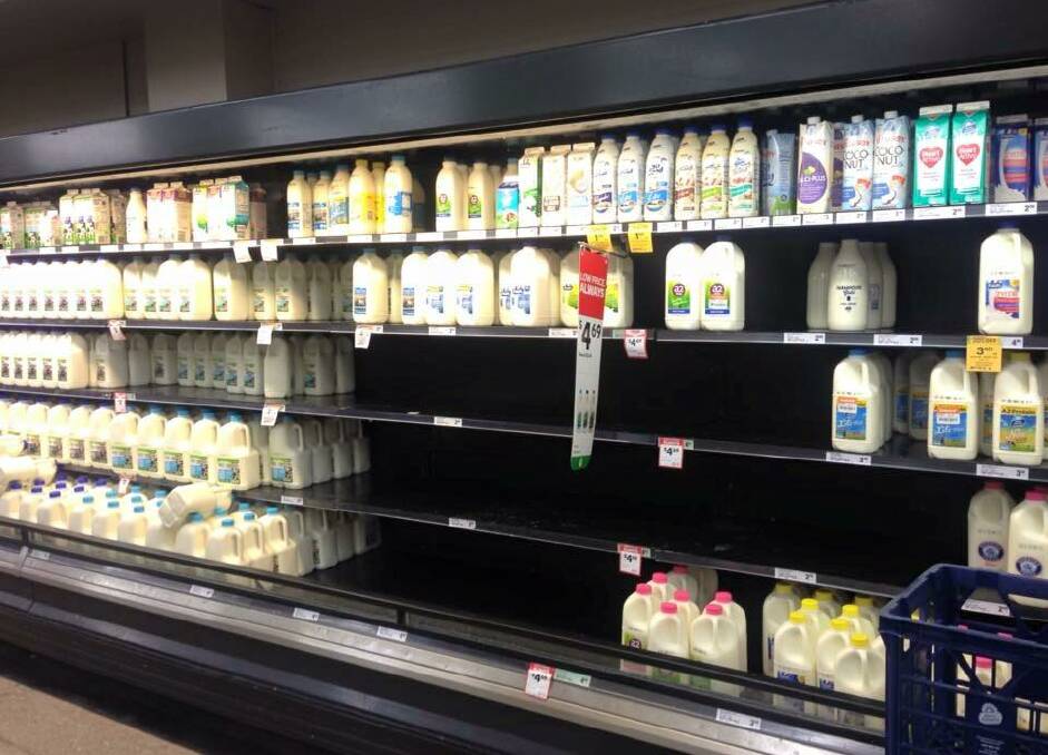 Mudgee woolies..... Hardly any of the local milk left on the shelf but the cheap stuff is just about full!  Photo: Lauren Wilkins