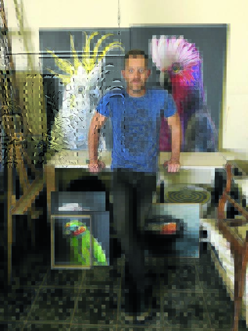 Charles Smith in his Mudgee workshop, surrounded by the avian portraits that will be exhibited this month in Bird Lord.