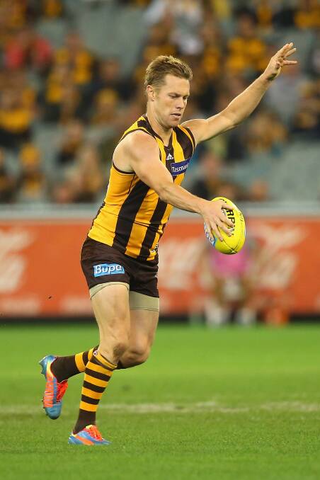Sam Mitchell of the Hawks kicks. The Hawks defeated the visiting Dockers 137-79. Picture: Getty Images