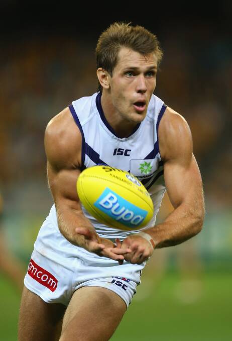 Matt De Boer of the Dockers handballs. The Hawks defeated the visiting Dockers 137-79. Picture: Getty Images