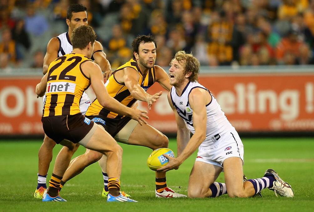 David Mundy of the Dockers handballs. The Hawks defeated the visiting Dockers 137-79. Picture: Getty Images