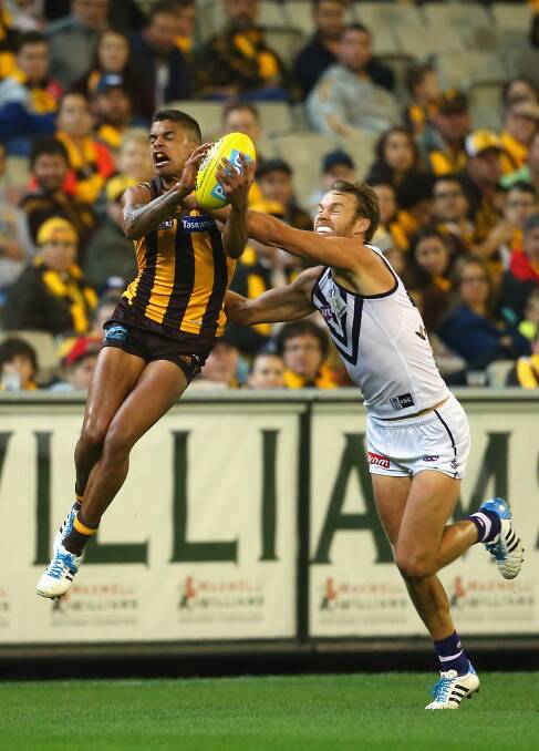 Bradley Hill of the Hawks marks infront of Paul Duffield of the Dockers. The Hawks defeated the visiting Dockers 137-79. Picture: Getty Images