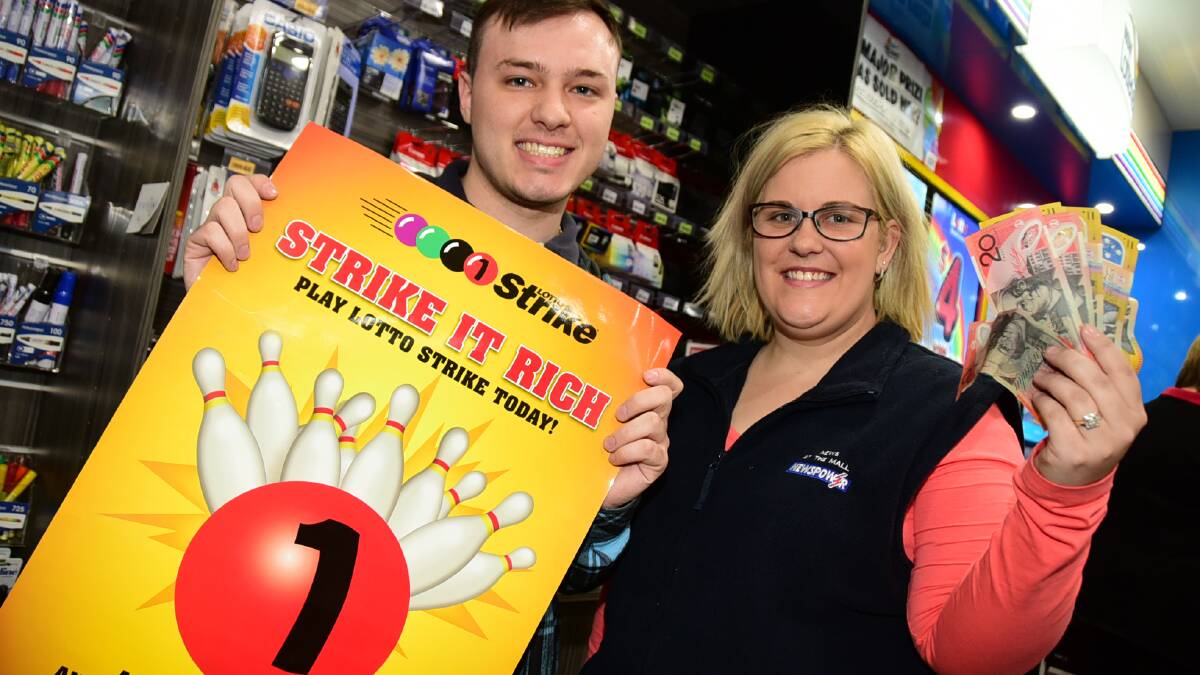 Lucas Thorne and Sarah Neely from News at the Mall where the winning Lotto ticket was sold. Photo: BELINDA SOOLE