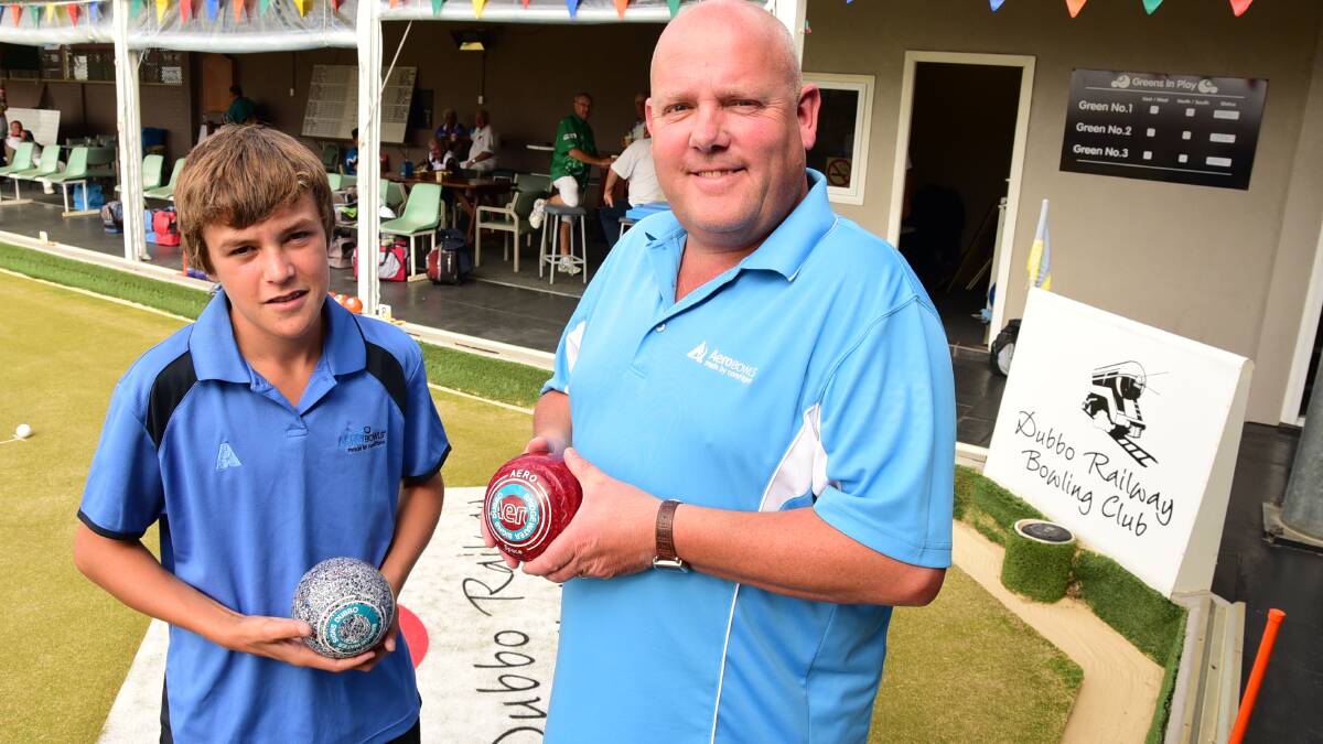 Dubbo's Jono Davis with lawn bowls champion Alex Marshall during day one of the Dubbo Masters Pairs tournament yesterday.  Photo: BELINDA SOOLE