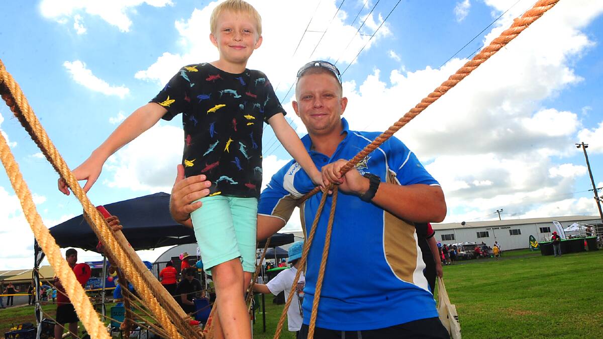 Bailey Petrie and his father Mitchell Petrie enjoying the rope climb at Dads for Kids. Photo: CHERYL BURKE