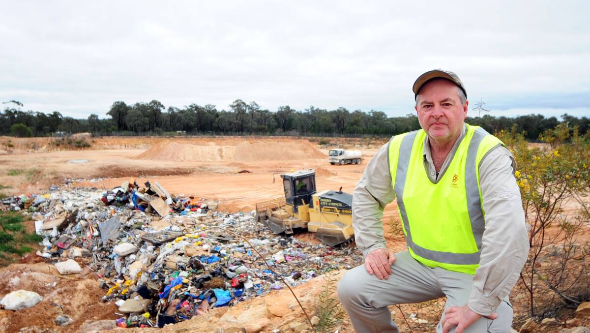 Whylandra waste depot supervisor Ron Willis with some of the 43,000 tonnes of rubbish received each year. Photo: BELINDA SOOLE