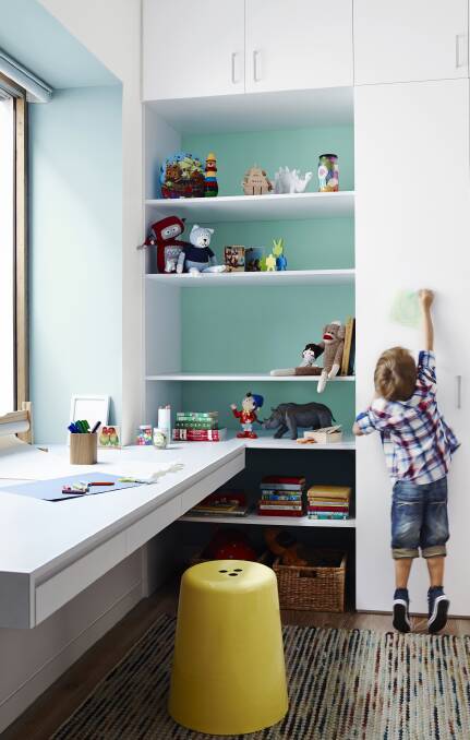Add contrast to a bookshelf with Surf Washand Shimmer Quarter to the walls. Photo: Dulux.
