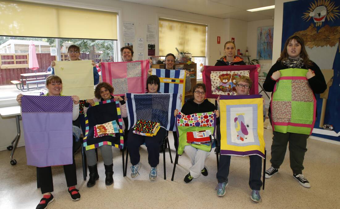 SPLASH OF COLOUR: Miranda Sellers, Naomi Barling, Tara Gaspert, Eden Ledgham, Olivia Robson, Samantha Eather, Takita Roberts, Libby Quigley, Rhiannon Hay and Amee Betts have been sewing pillowcases for sick kids. Absent is Kate Kotzur. Photo: CONTRIBUTED
