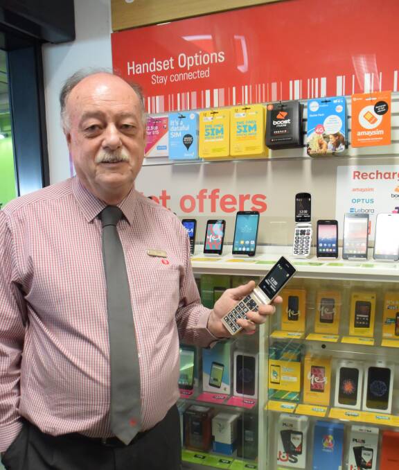 RECOGNITION FOR HIS WORK: Australia Post East Dubbo managing director Chris Kingsland has won a competition after selling SIM cards and phones. Photo: ORLANDER RUMING