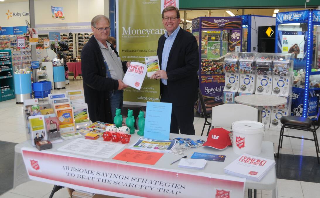 SAVING STRATEGIES: Salvation Army Moneycare financial counsellor Rob Benton and Deputy Premier Troy Grant were at Delroy Shopping Centre to encourage people to save. Photo: ORLANDER RUMING