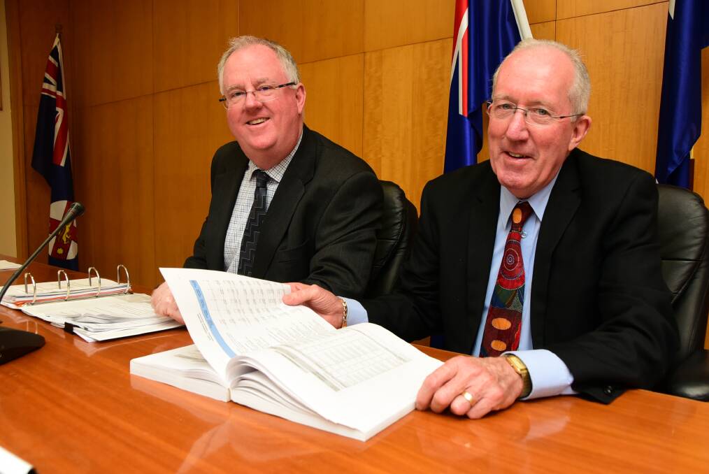 FINANCIAL PLAN: Council's interim general manager Mark Riley and administrator Michael Kneipp with the new budget. Photo: BELINDA SOOLE