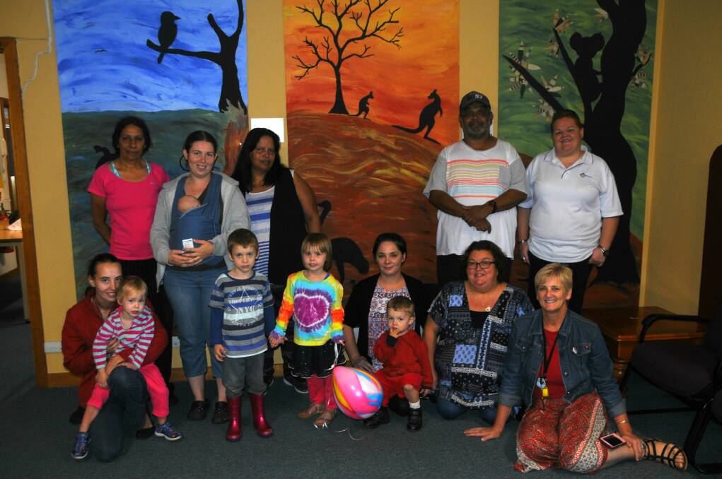 SPLASH OF COLOUR: The Buninyong Art Buddies have brightened the walls of the Dubbo Community Health with their artwork. Photo: ORLANDER RUMING