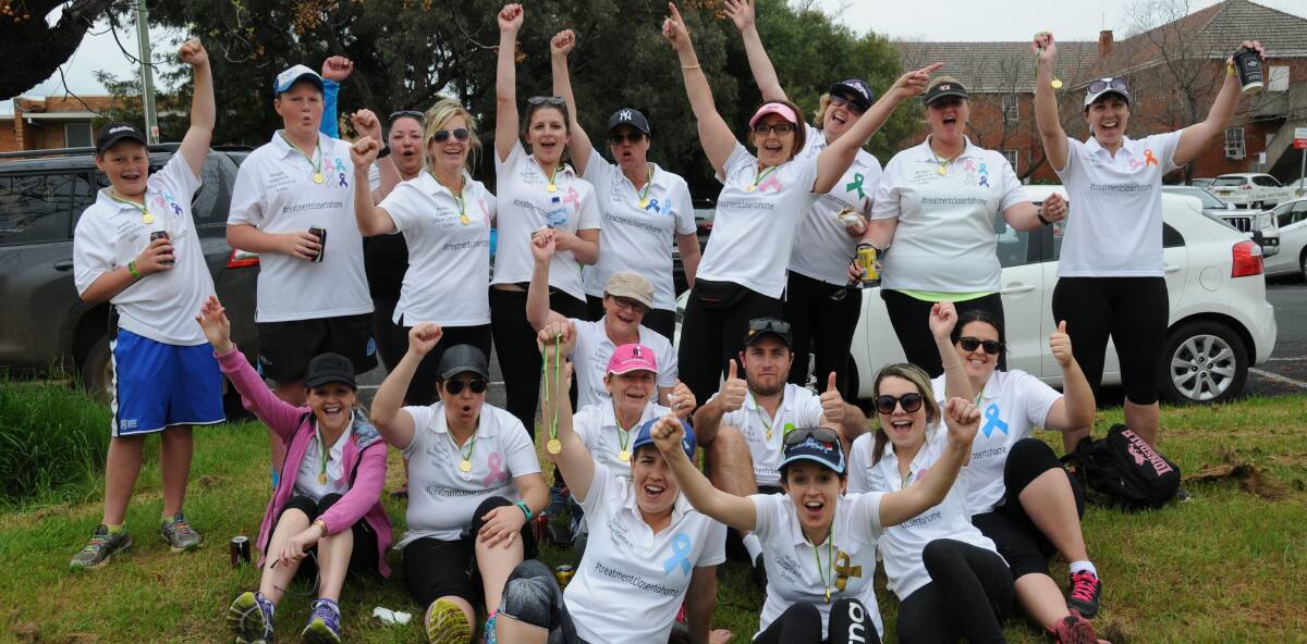 WE DID IT: Celebrations after the walkers made it the 130 kilometres from Dubbo to Mudgee in honour of a cancer centre. Photo: ORLANDER RUMING
