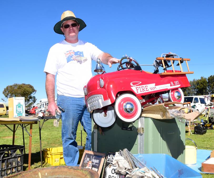 FOR SALE: Paul Brendan with some of the wares for sale at Macquarie Lions Swap Meet Car and Bike Show on Sunday. Photo: BELINDA SOOLE
