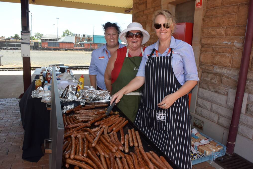 HELPING THE ANIMALS: Stacy Locke, Margaret Roberts and Belinda Roberts held the sausage sizzle to help raise money for feed in the coming months. Photo: ORLANDER RUMING