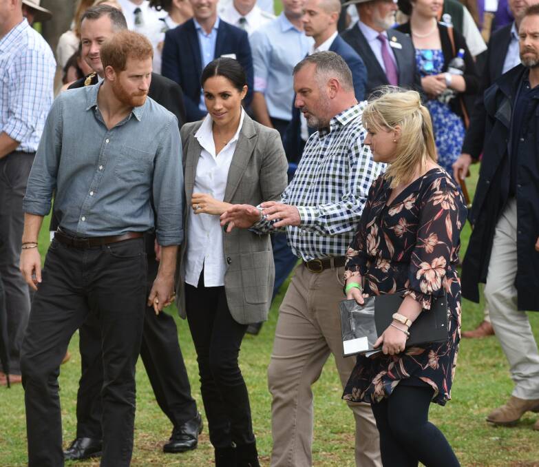 SPECIAL DAY: The Duke and Duchess of Sussex talking to Dubbo Regional Council's Jason Yelverton and Josie Howard during their visit. Photo: AMY MCINTYRE