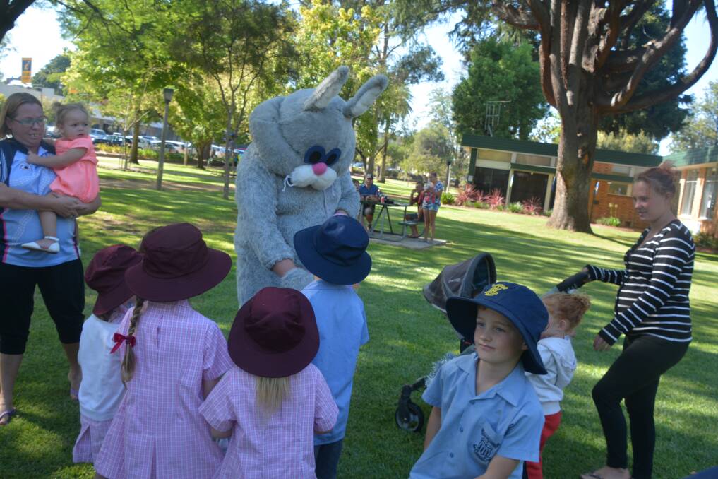 The Easter bunny with children from St Mary's Primary School at Cameron Park last year.