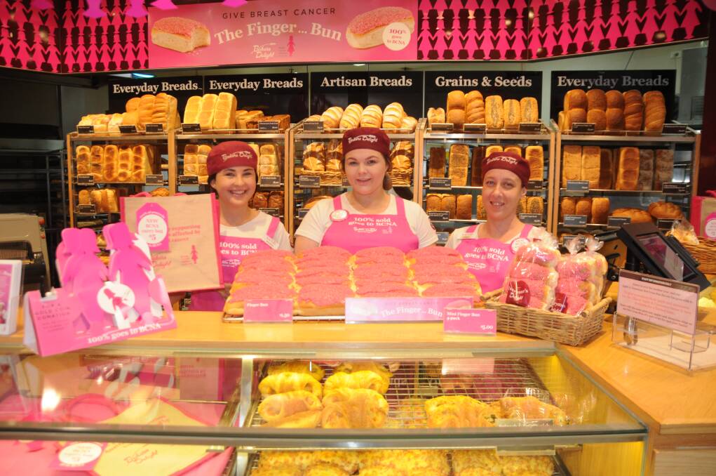 PINK-TINGED AWARENESS: Maddi Montague, Jenny Hill and Angela Brownlee at Bakers Delight Dubbo are encouraging the community to support the worthy cause. Photo: ORLANDER RUMING