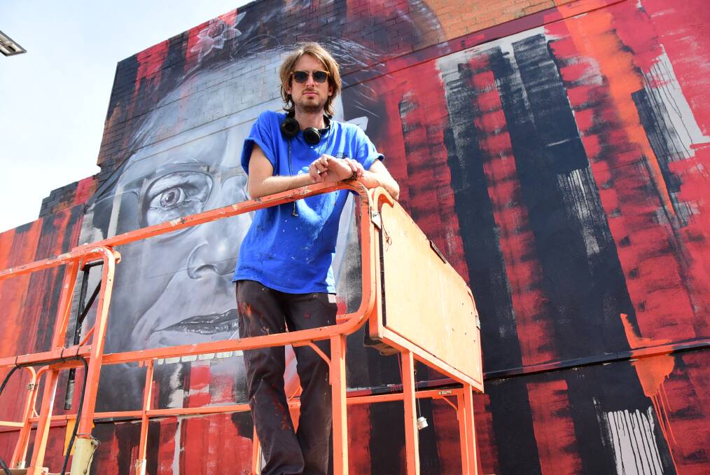 INJECTION OF COLOUR: Matt Adnate painted a portrait of Pearl Gibbs on the corner of Talbragar and Darling streets as part of Ignite. Photo: PAIGE WILLIAMS