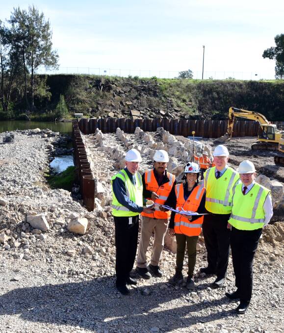 FLOOD CLEARING: Michael Kneipp, Jo Joseph, Sam de Souza, Mark Riley and Stewart McLeod at the South Dubbo Weir, where work has temporarily been halted due to the rain. Photo: BELINDA SOOLE
