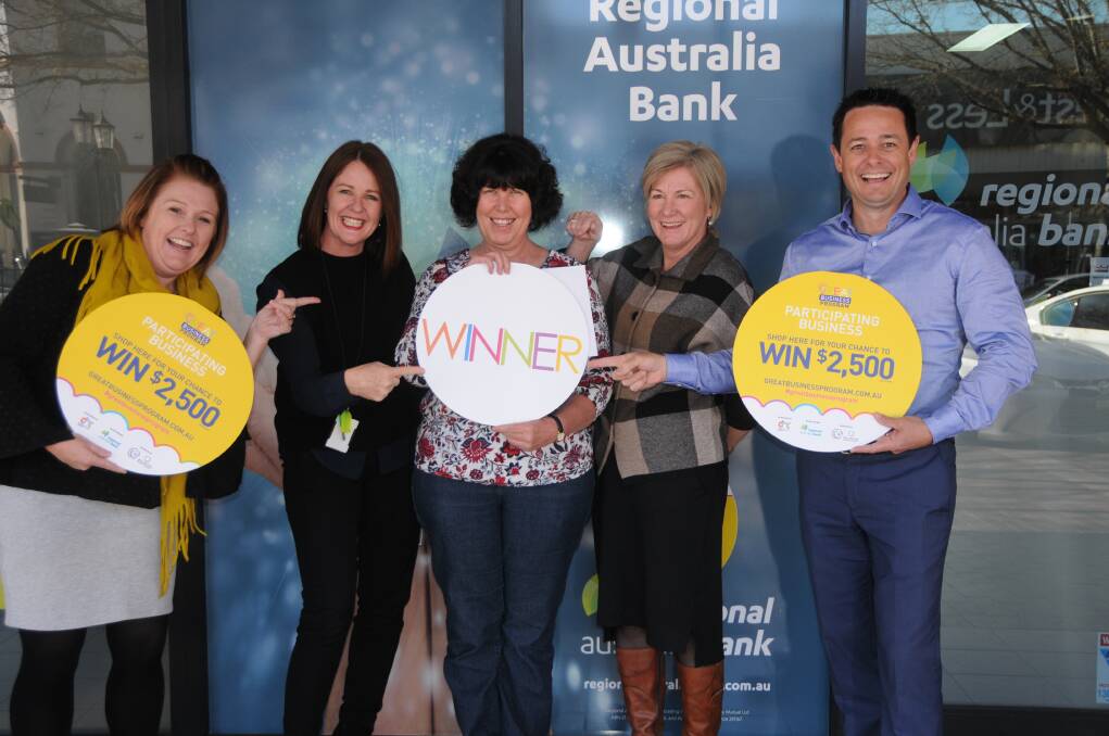 WINNER, WINNER CHICKEN DINNER: Joy Cannon (middle) congratulated by Dubbo Regional Council's Tammy Pickering, Jacki Parish and Julie Webster, as well as Dubbo Business Chamber president Matt Wright. Photo: ORLANDER RUMING