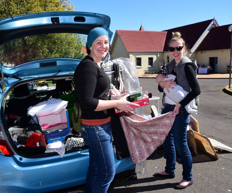 GIVING FUNDRAISING THE BOOT: Amy Smith with Bek Weber and Harry Weber at the Car Boot Sale on Saturday. Photo: BELINDA SOOLE